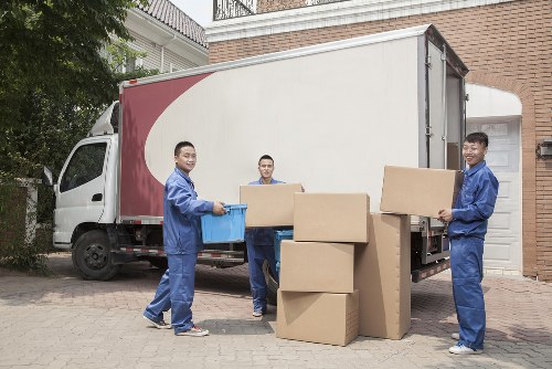 Moving team loading belongings safely into a van