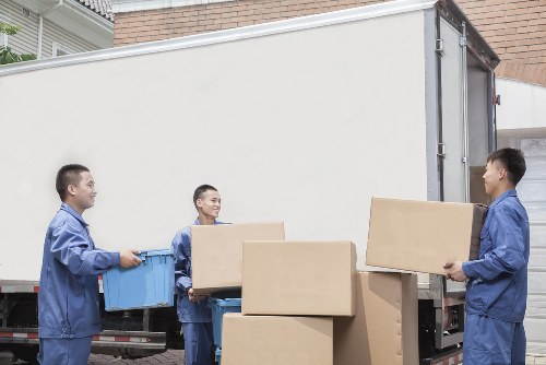 North Woolwich moving crew handling boxes with care during loading