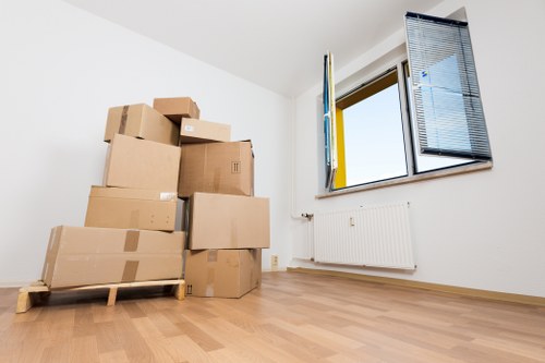 Workers loading household items for a local removals service in North Woolwich