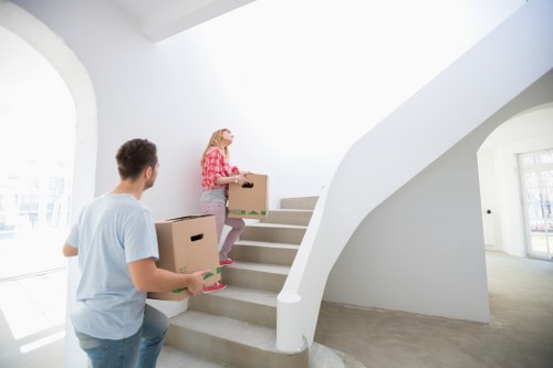Local movers handling furniture and boxes in North Woolwich