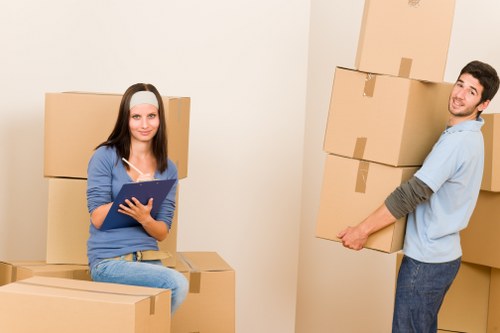 Loading furniture into a van for transport in North Woolwich